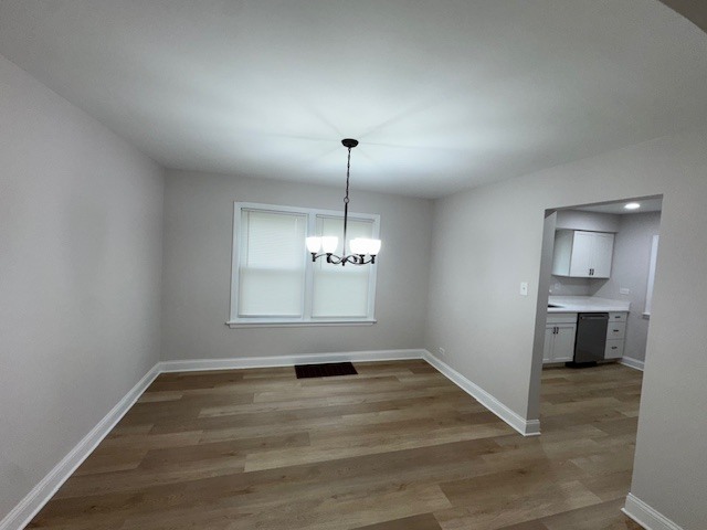 10454 South Forest Avenue Chicago, IL 60628 - Photo 4 of 16 a view of empty room with wooden floor