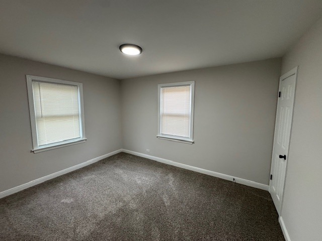 10454 South Forest Avenue Chicago, IL 60628 - Photo 7 of 16 an empty room with a window