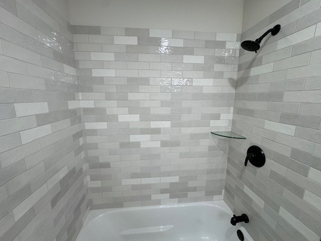 10454 South Forest Avenue Chicago, IL 60628 - Photo 9 of 16 a bathroom with a bathtub