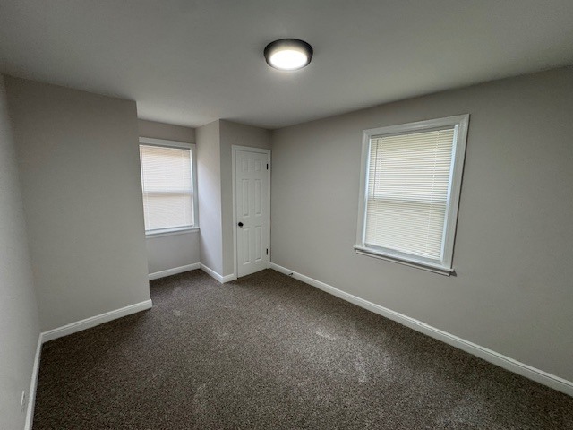 10454 South Forest Avenue Chicago, IL 60628 - Photo 10 of 16 an empty room with windows and closet