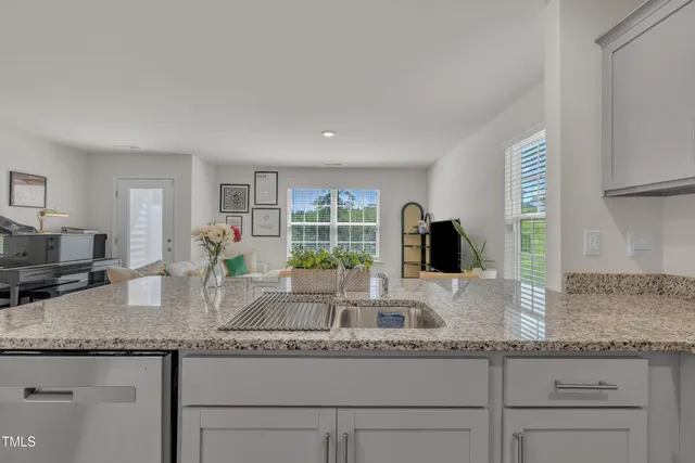a kitchen with granite countertop a sink and a granite counter tops