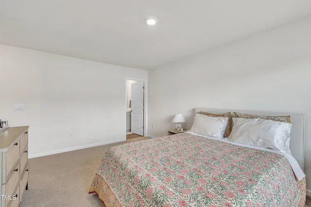 a bedroom with a bed and a cabinets