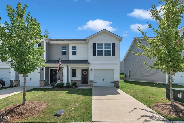 a front view of a house with a yard