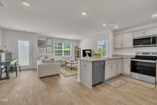a kitchen with stove and cabinets