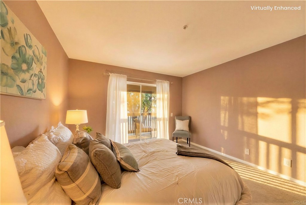 104 South Cross Creek Road, Unit M Orange, CA 92869 - Photo 13 of 34 a bedroom with a large bed and a large window