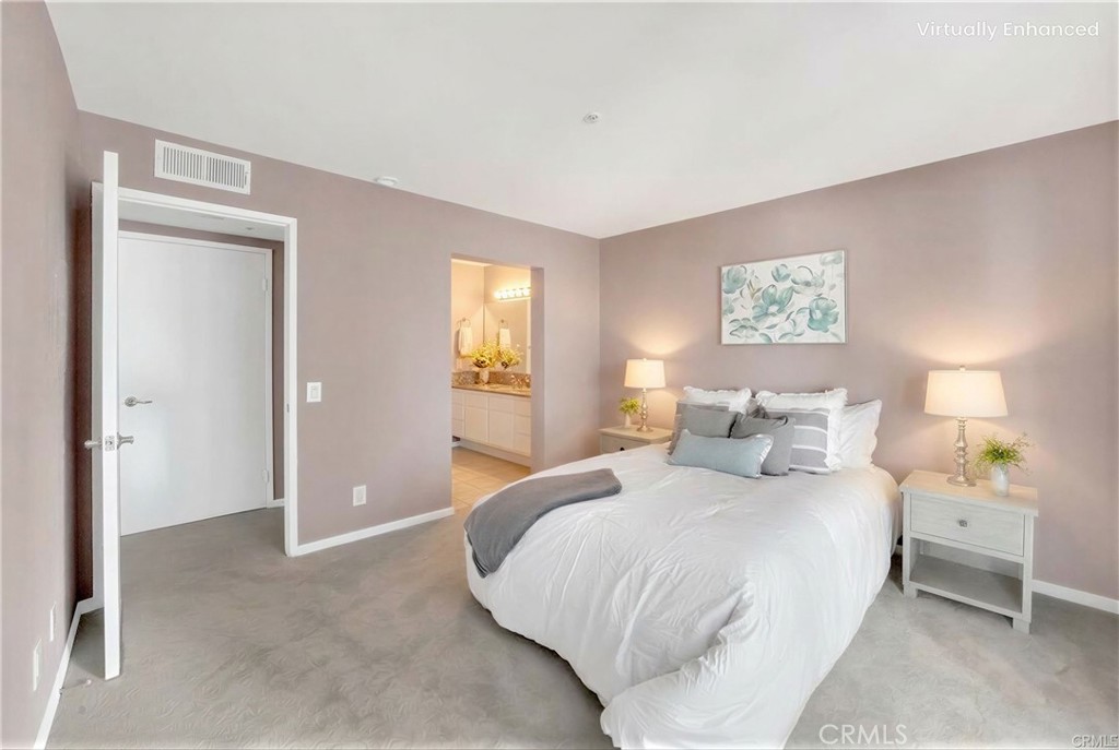 104 South Cross Creek Road, Unit M Orange, CA 92869 - Photo 14 of 34 a bedroom with a bed and a painting on the wall