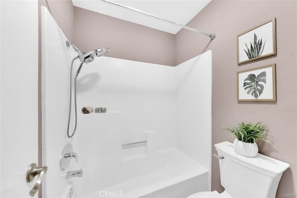 104 South Cross Creek Road, Unit M Orange, CA 92869 - Photo 16 of 34 a bathroom with a shower curtain