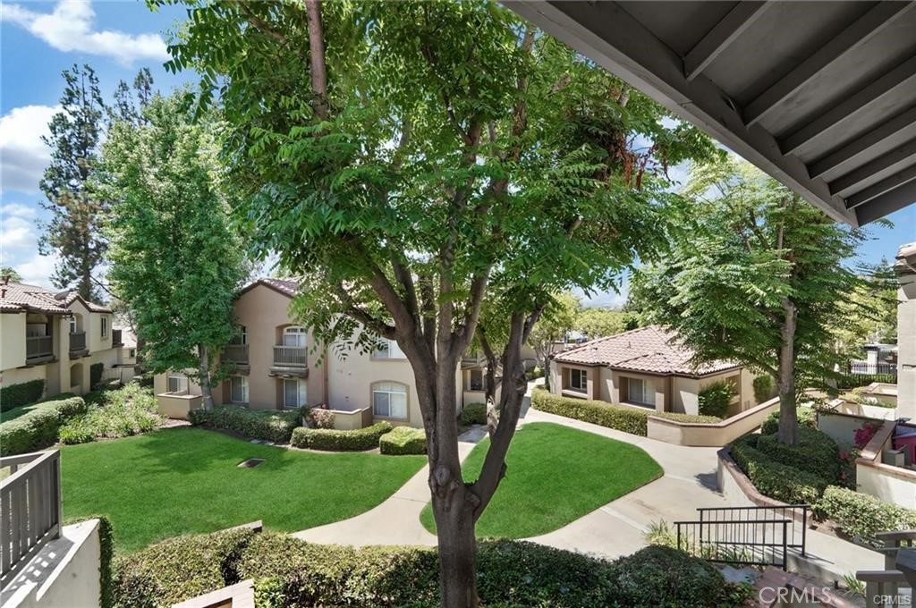 104 South Cross Creek Road, Unit M Orange, CA 92869 - Photo 20 of 34 a front view of a house with garden
