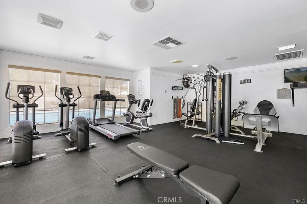 104 South Cross Creek Road, Unit M Orange, CA 92869 - Photo 25 of 34 a view of a room with gym equipment