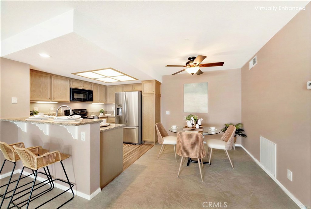 104 South Cross Creek Road, Unit M Orange, CA 92869 - Photo 5 of 34 a dining room with furniture and kitchen view