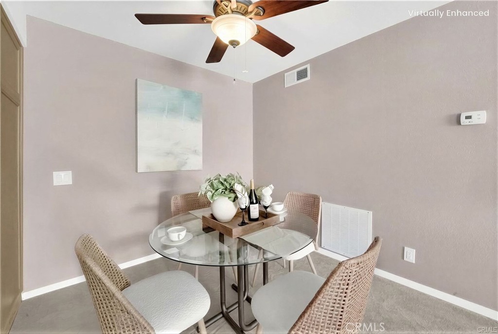 104 South Cross Creek Road, Unit M Orange, CA 92869 - Photo 6 of 34 a view of a dining room with furniture and wooden floor