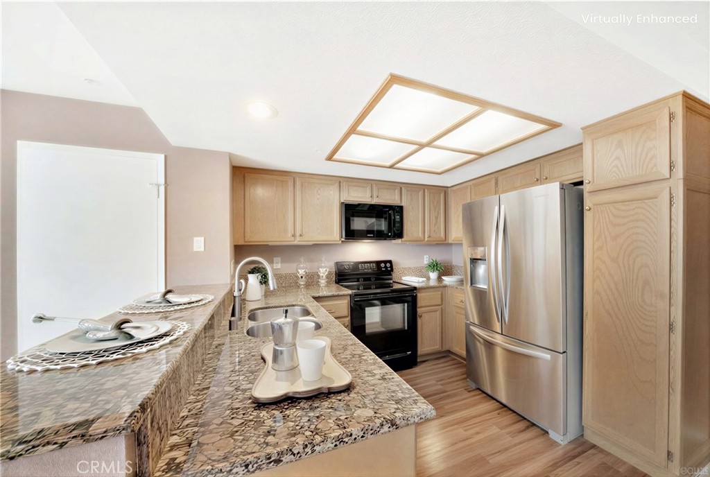 104 South Cross Creek Road, Unit M Orange, CA 92869 - Photo 8 of 34 a kitchen with stainless steel appliances granite countertop a sink stove and refrigerator