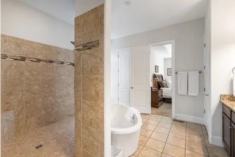 a bathroom with a bathtub and a toilet