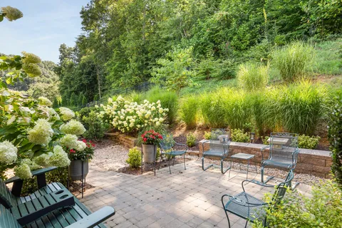 a view of a backyard with sitting area