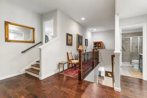 a view of a hallway with seating area