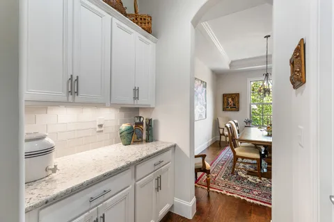 a kitchen with sink cabinets and stove top oven