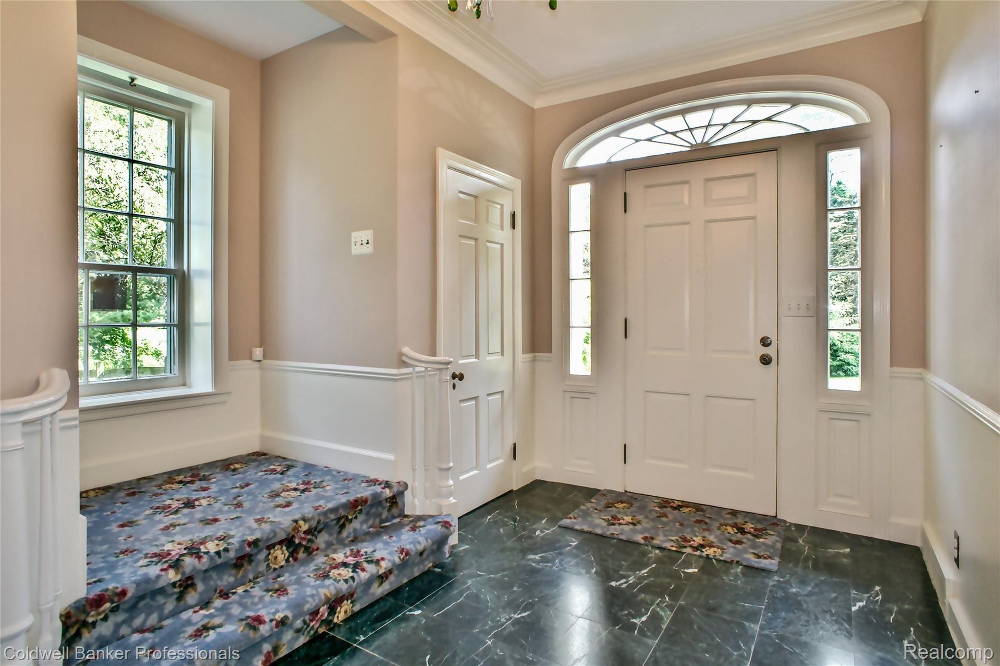 7755 Holcomb Road Clarkston, MI 48348 - Photo 12 of 51 Formal front entrance of grand pillar porch with herring brick complete with green marble flooring.