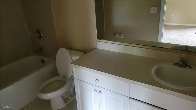a bathroom with a sink a toilet and bathtub