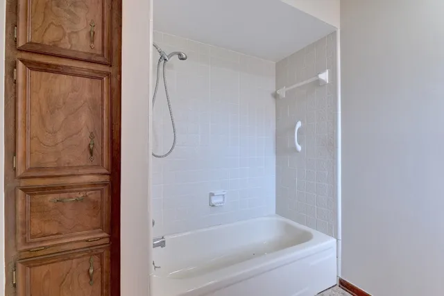 a bathroom with a glass shower door