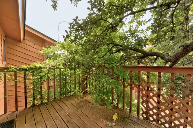 a backyard of a house with wooden fence