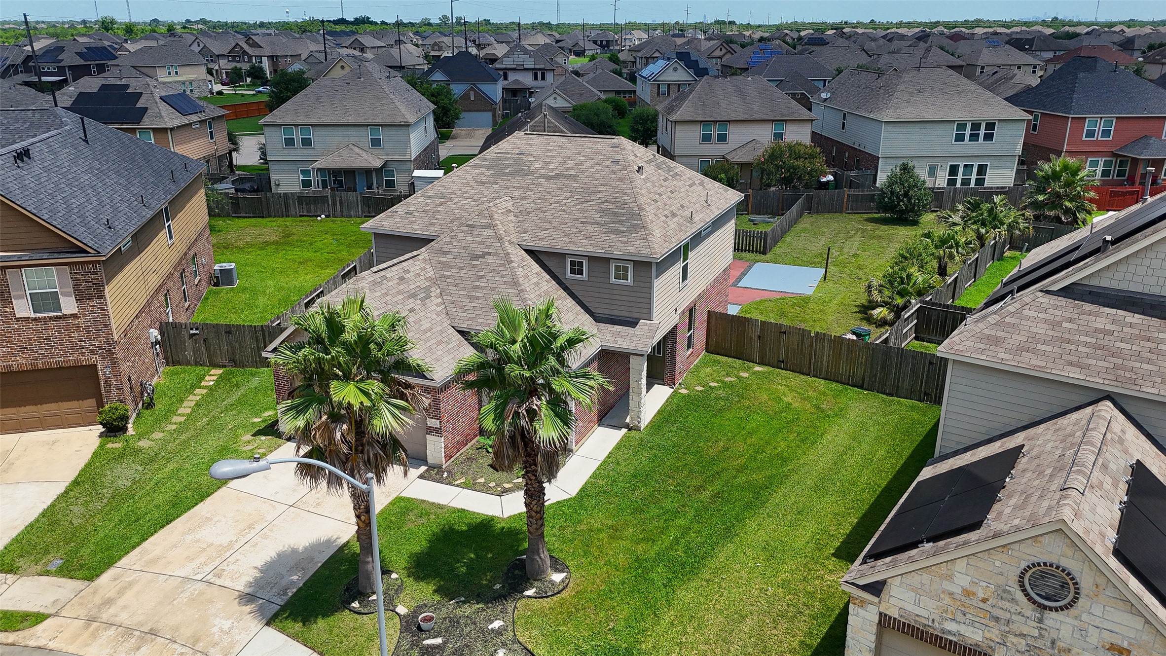 2702 Modano Court Fresno, TX 77545 - Photo 44 of 46 an aerial view of multiple houses with yard