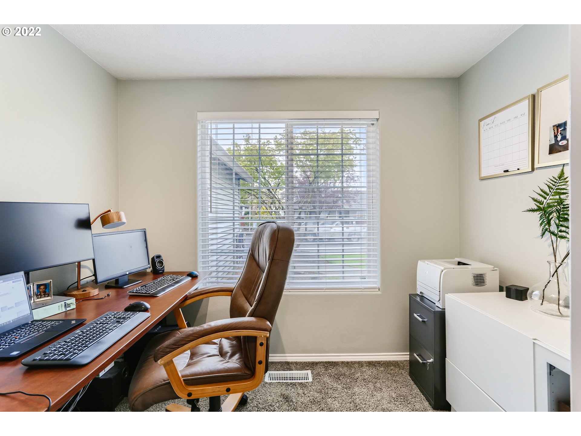 1547 Northeast 19th Loop Canby, OR 97013 - Photo 16 of 28 a view of a workspace with furniture and a window
