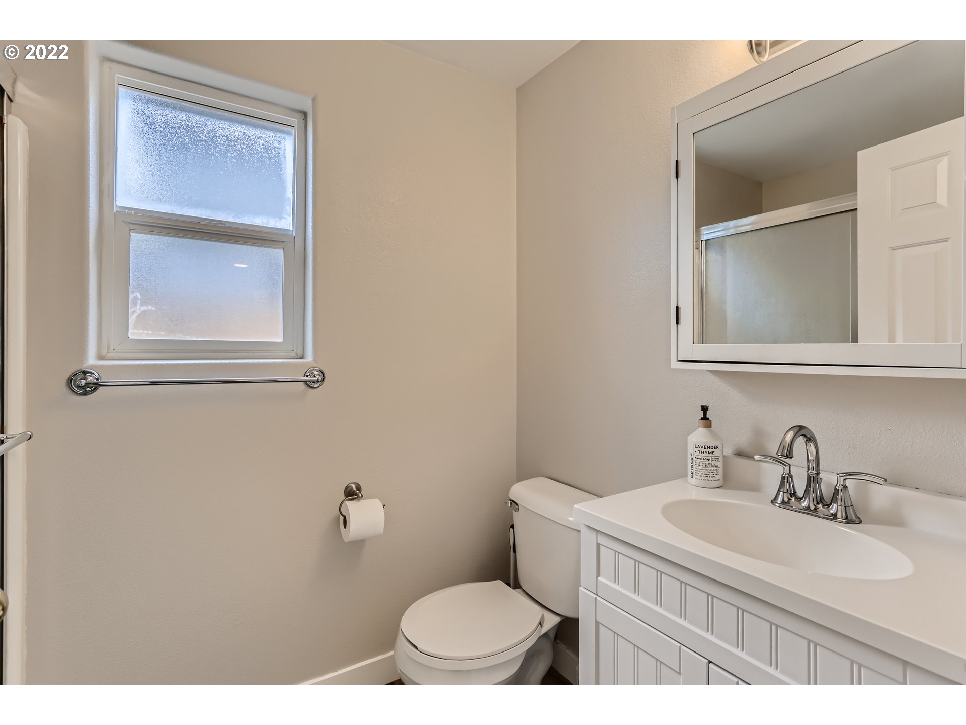 1547 Northeast 19th Loop Canby, OR 97013 - Photo 20 of 28 a bathroom with a sink a toilet and mirror