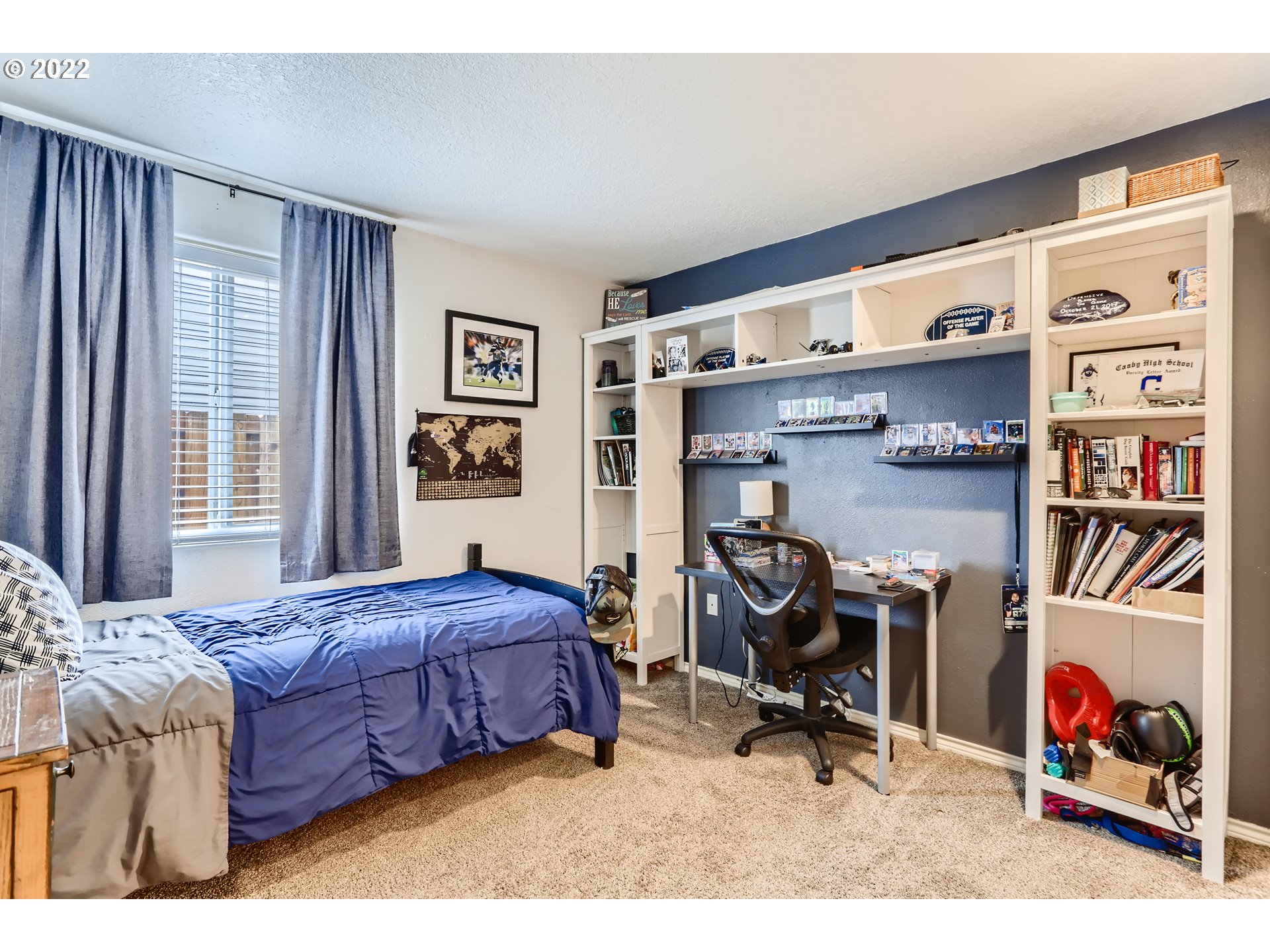 1547 Northeast 19th Loop Canby, OR 97013 - Photo 21 of 28 a bedroom with furniture and a bed