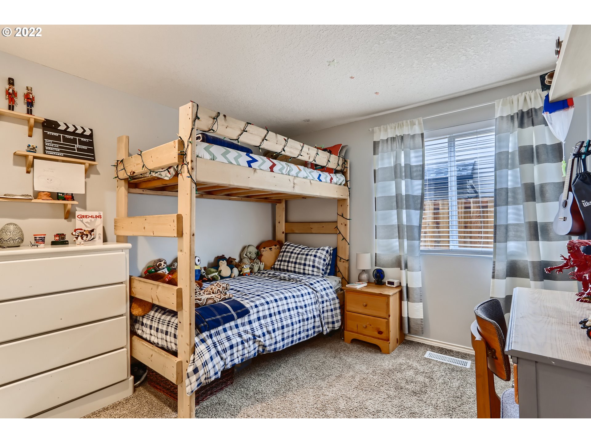 1547 Northeast 19th Loop Canby, OR 97013 - Photo 22 of 28 a bedroom with a bed and a window