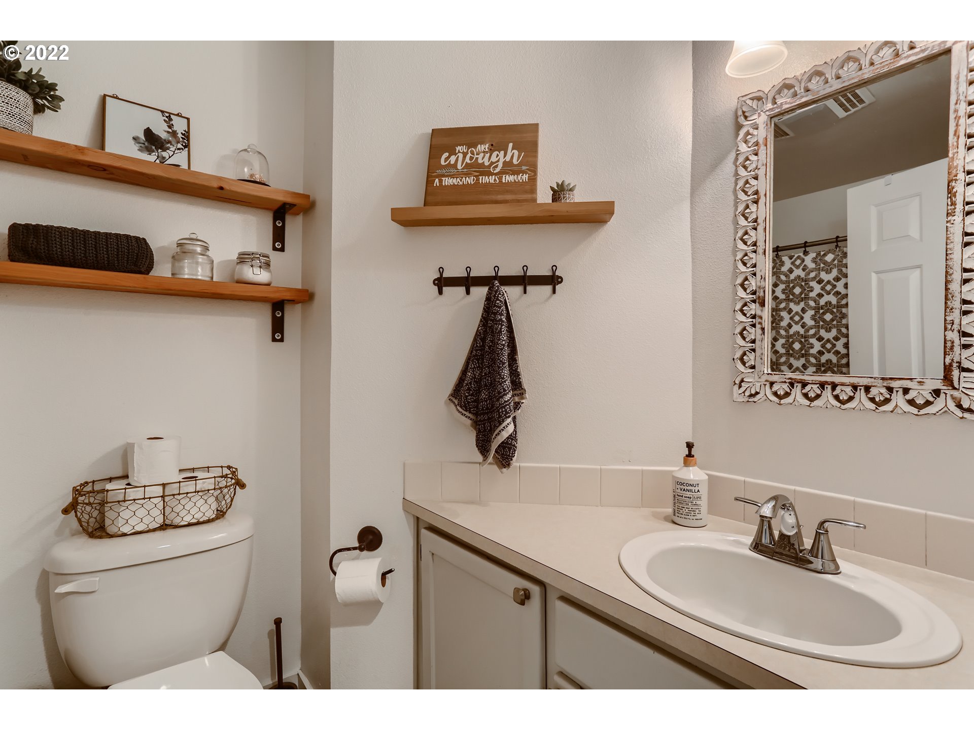 1547 Northeast 19th Loop Canby, OR 97013 - Photo 23 of 28 a bathroom with a sink and a mirror