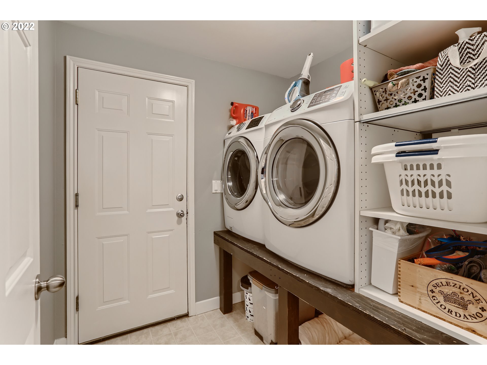 1547 Northeast 19th Loop Canby, OR 97013 - Photo 24 of 28 a view of storage and utility room with washer and dryer