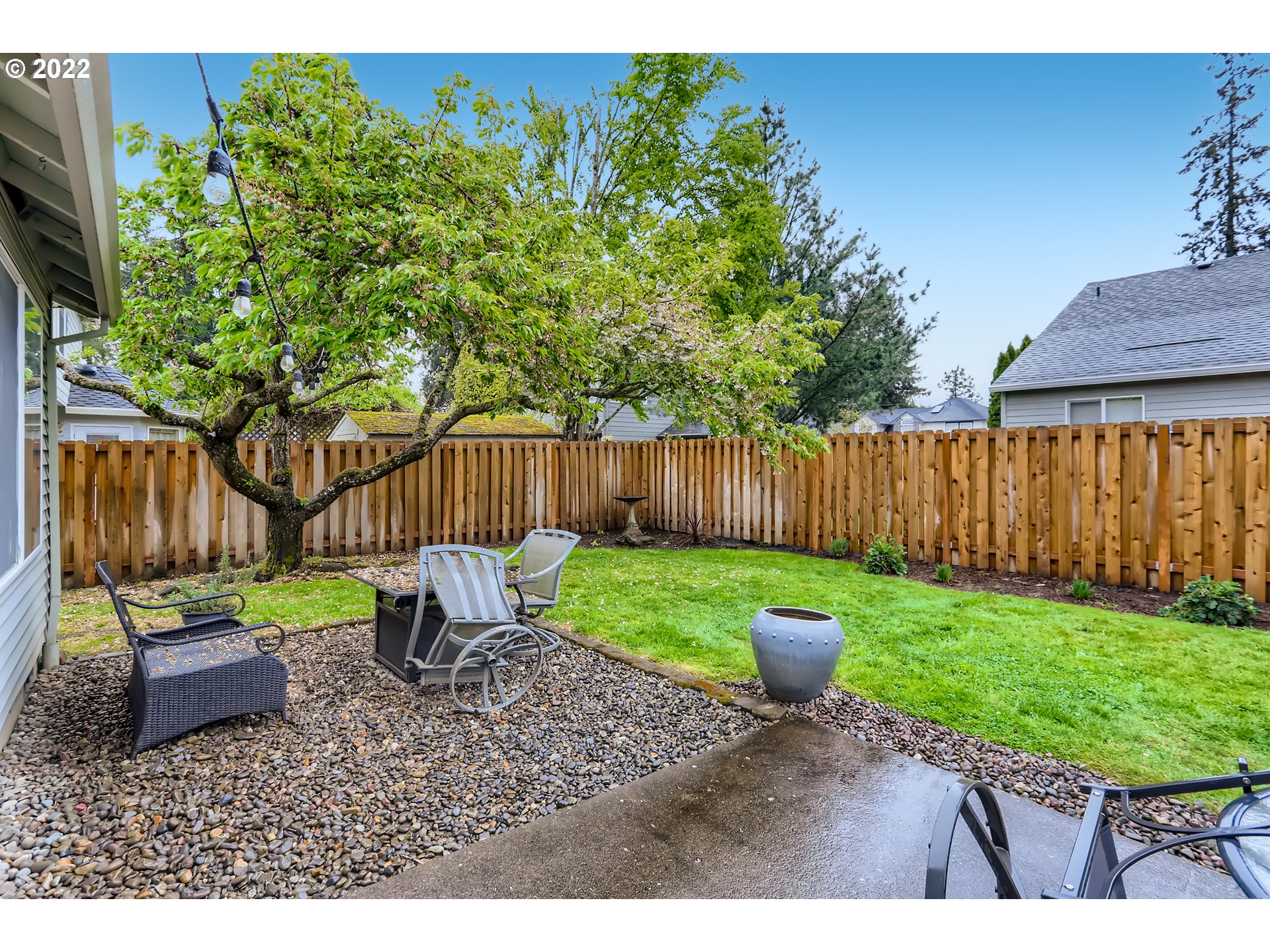1547 Northeast 19th Loop Canby, OR 97013 - Photo 25 of 28 a backyard of a house with table and chairs