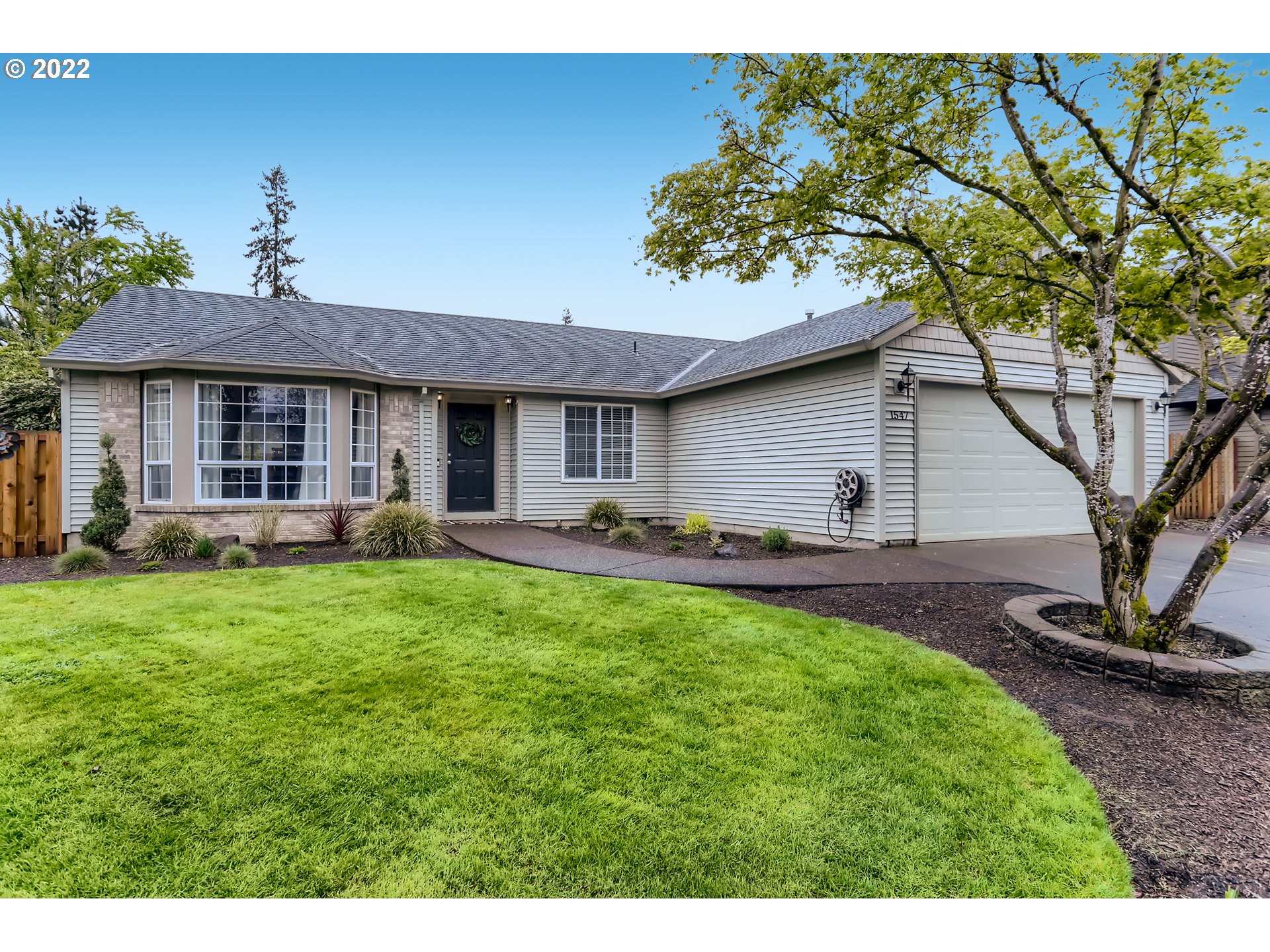 1547 Northeast 19th Loop Canby, OR 97013 - Photo 27 of 28 a view of a yard with a house