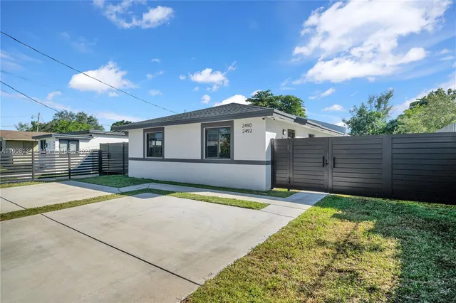 a house view with a backyard space