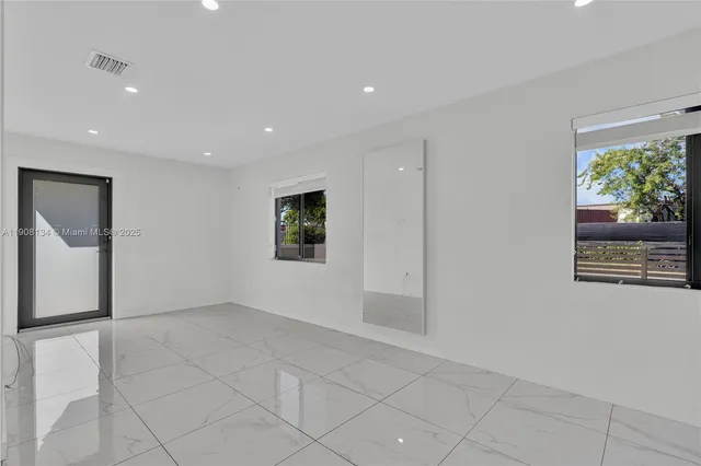 a view of an empty room and window