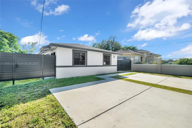 a house view with a backyard space