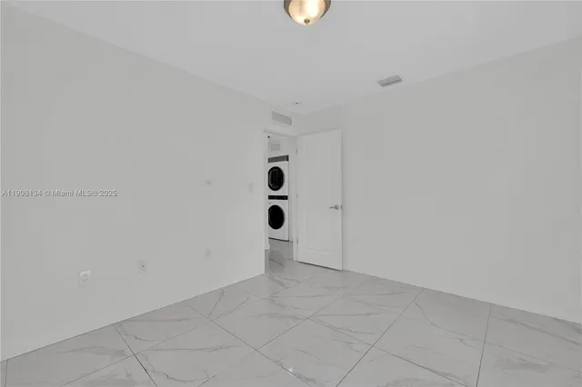 a view of a hallway with washer and dryer