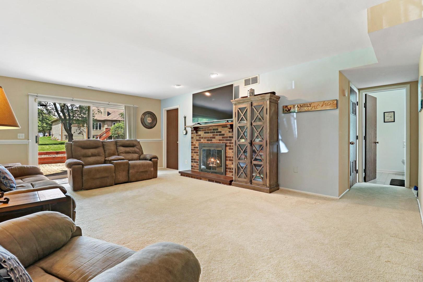 1016 Butler Drive Crystal Lake, IL 60014 - Photo 13 of 20 a living room with furniture and a flat screen tv