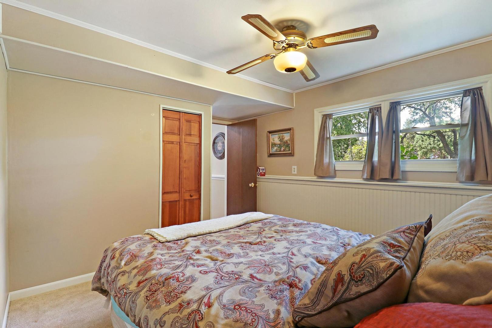 1016 Butler Drive Crystal Lake, IL 60014 - Photo 18 of 20 a bedroom with a bed and window