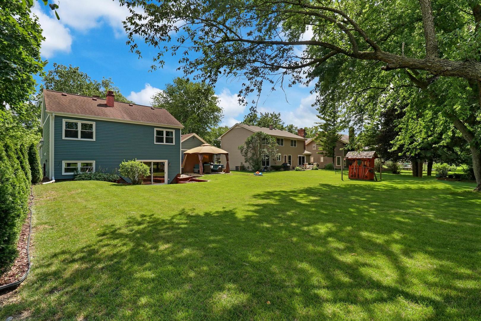 1016 Butler Drive Crystal Lake, IL 60014 - Photo 20 of 20 a front view of a house with garden