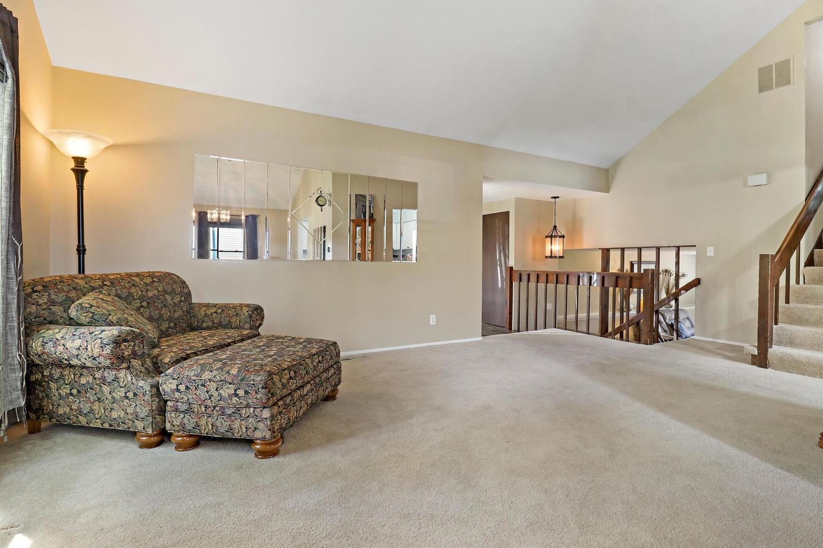 1016 Butler Drive Crystal Lake, IL 60014 - Photo 4 of 20 a living room with furniture and a window