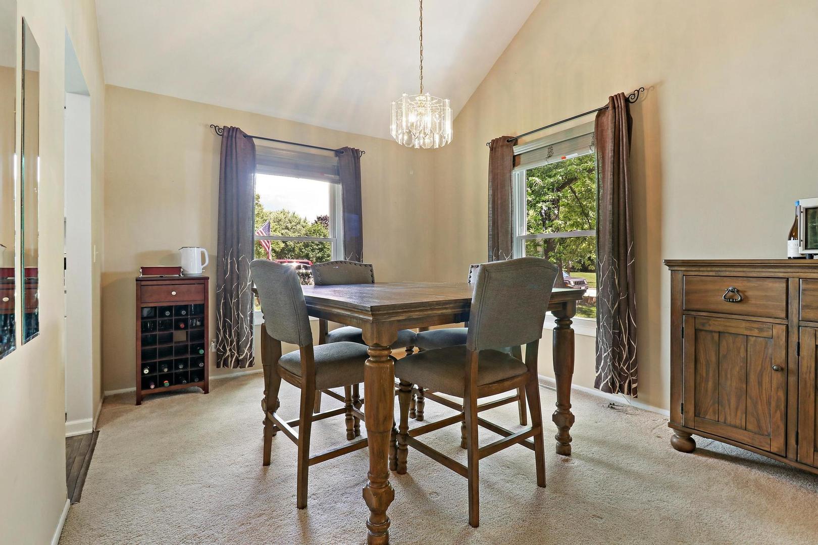 1016 Butler Drive Crystal Lake, IL 60014 - Photo 5 of 20 a view of a dining room with furniture window and outside view
