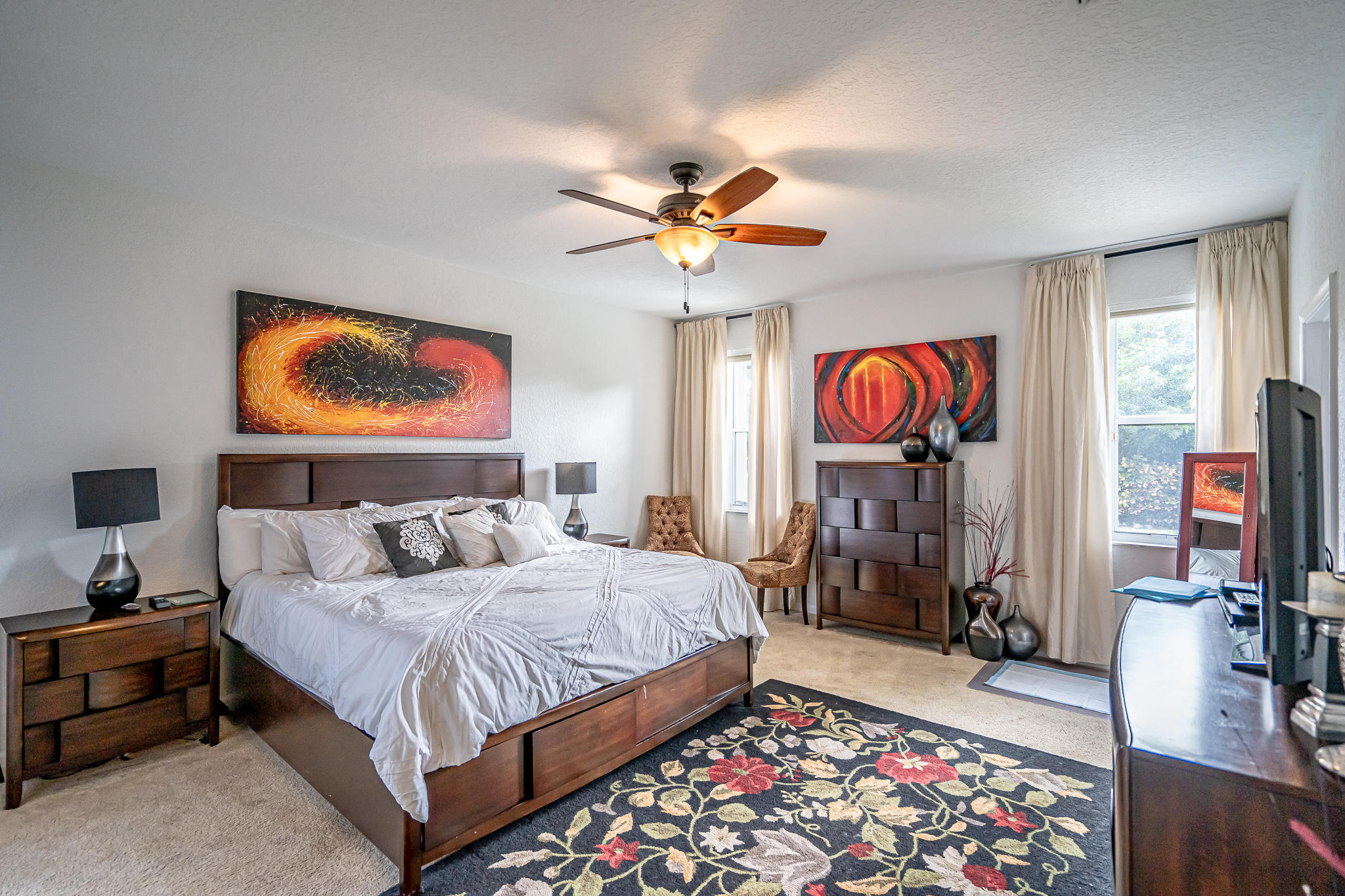 22821 Chelsea Wood Court Boca Raton, FL 33433 - Photo 12 of 43 a bedroom with bed and a chandelier