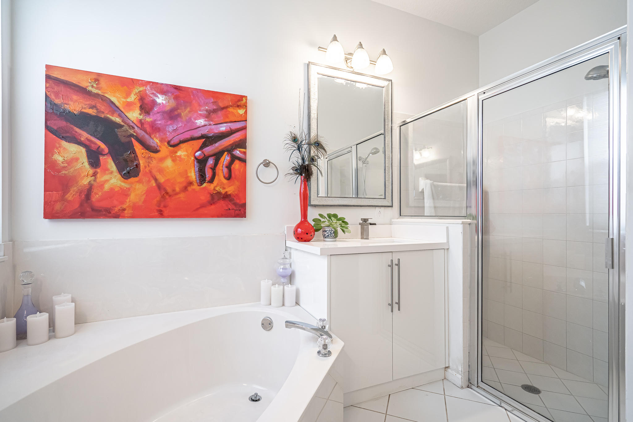 22821 Chelsea Wood Court Boca Raton, FL 33433 - Photo 14 of 43 a bathroom with a tub a sink and mirror