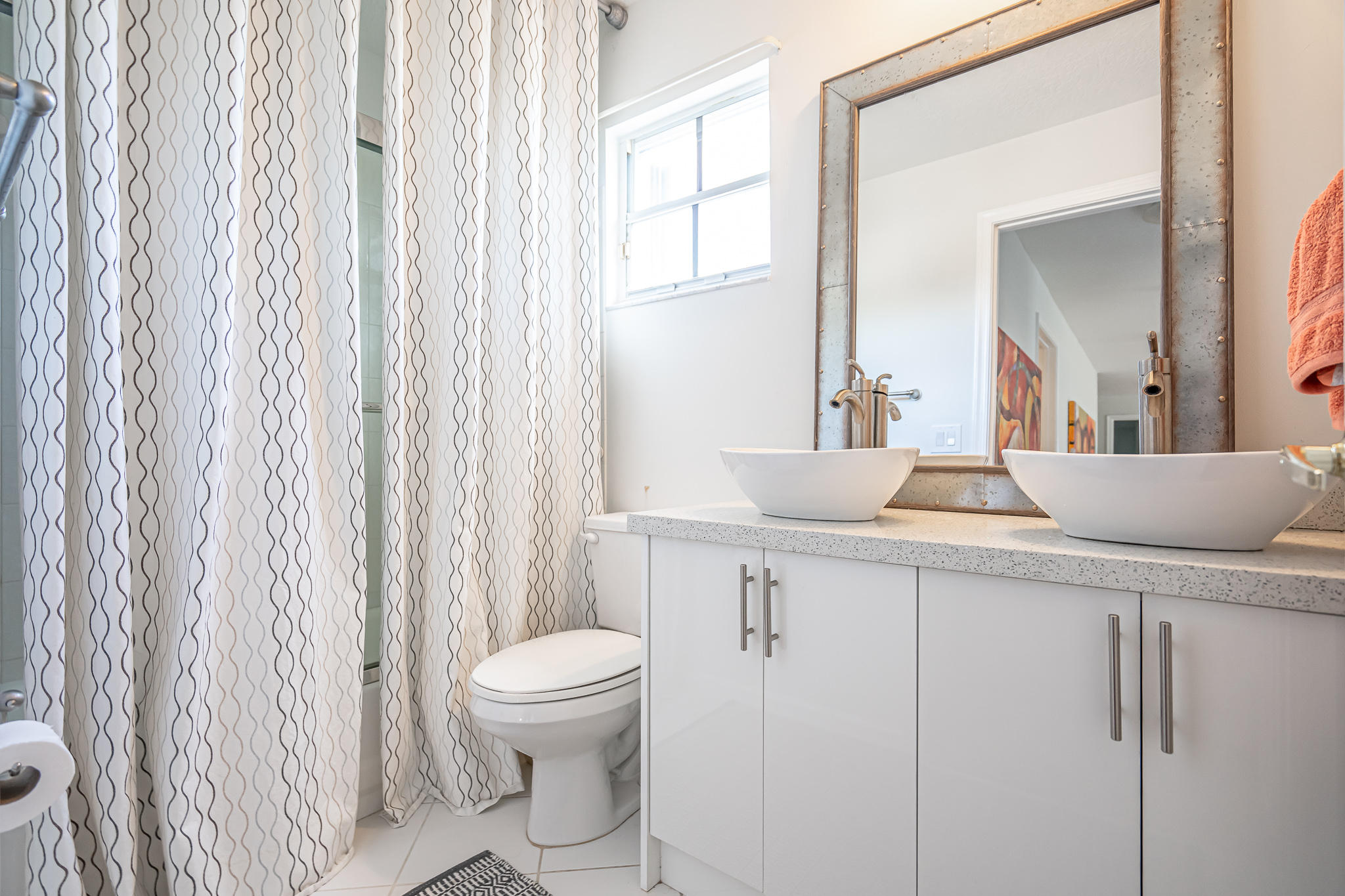 22821 Chelsea Wood Court Boca Raton, FL 33433 - Photo 16 of 43 a bathroom with a toilet a sink and a mirror