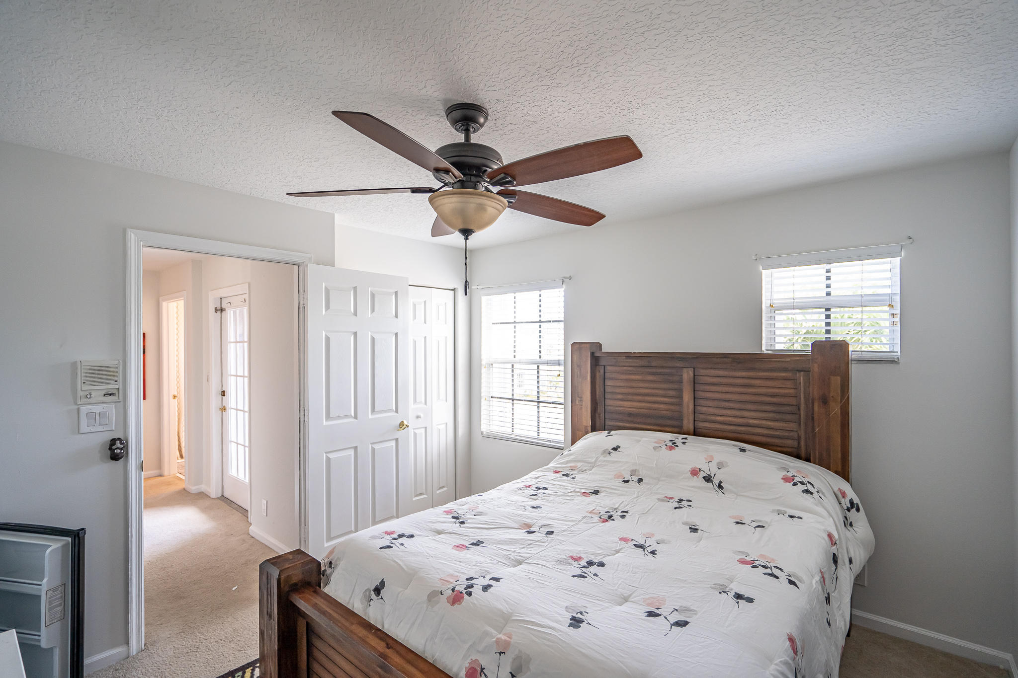22821 Chelsea Wood Court Boca Raton, FL 33433 - Photo 17 of 43 a view of a bedroom with a bed and a chandelier fan
