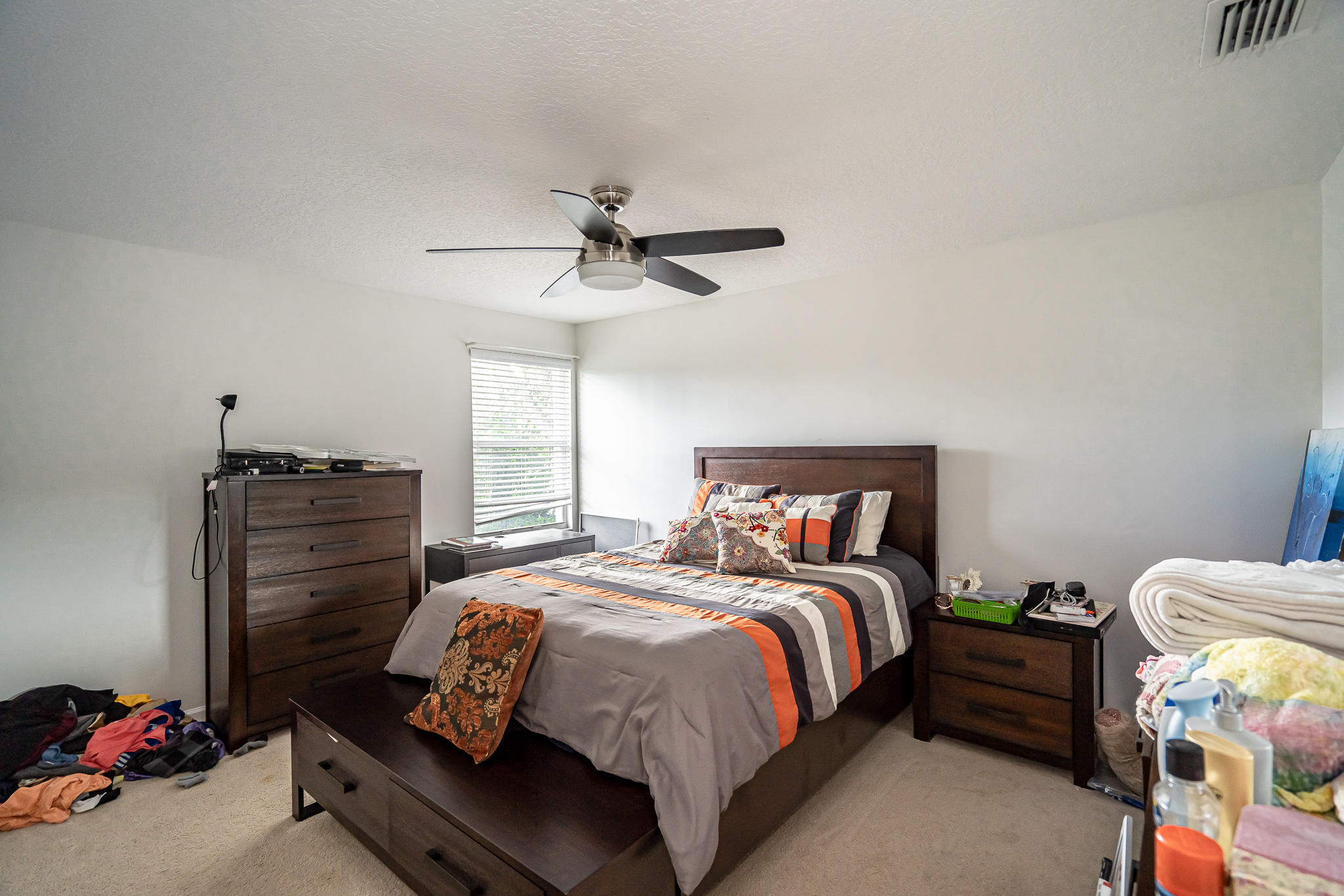 22821 Chelsea Wood Court Boca Raton, FL 33433 - Photo 18 of 43 a bedroom with a bed and a chandelier