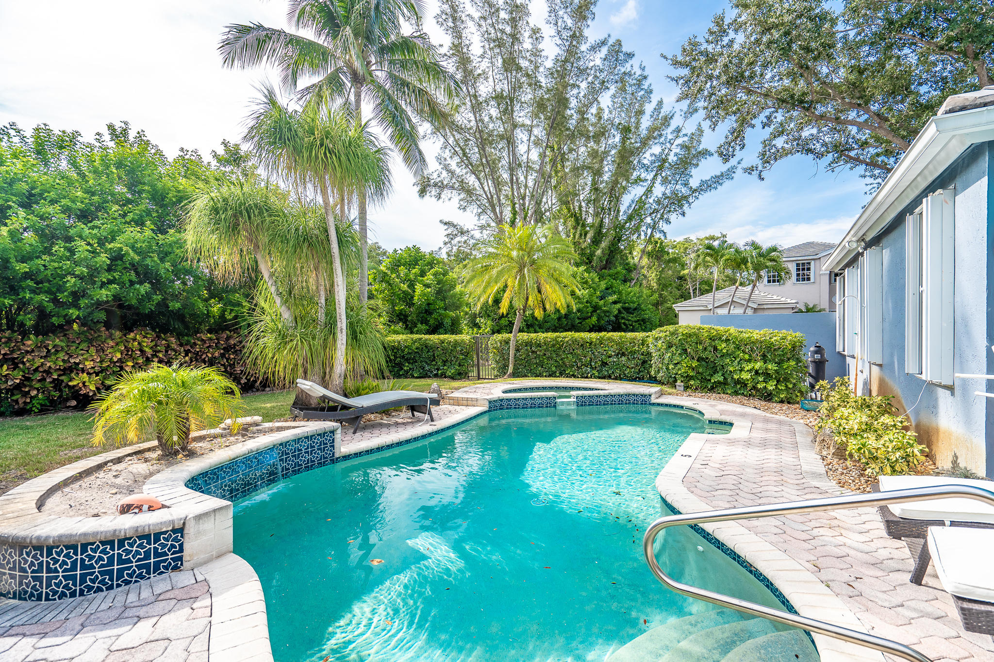 22821 Chelsea Wood Court Boca Raton, FL 33433 - Photo 21 of 43 a view of a swimming pool with a patio