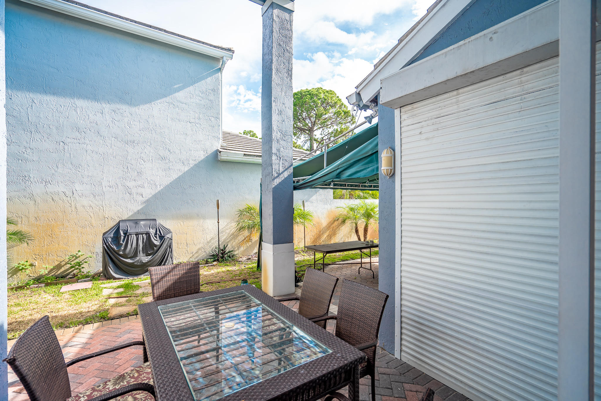 22821 Chelsea Wood Court Boca Raton, FL 33433 - Photo 25 of 43 a view of balcony with two chairs and a table