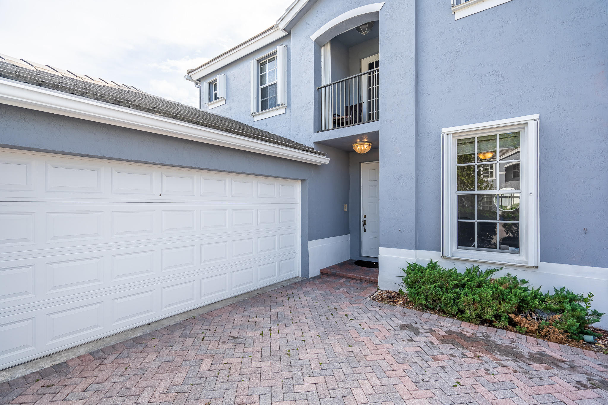 22821 Chelsea Wood Court Boca Raton, FL 33433 - Photo 31 of 43 a front view of a house with a yard